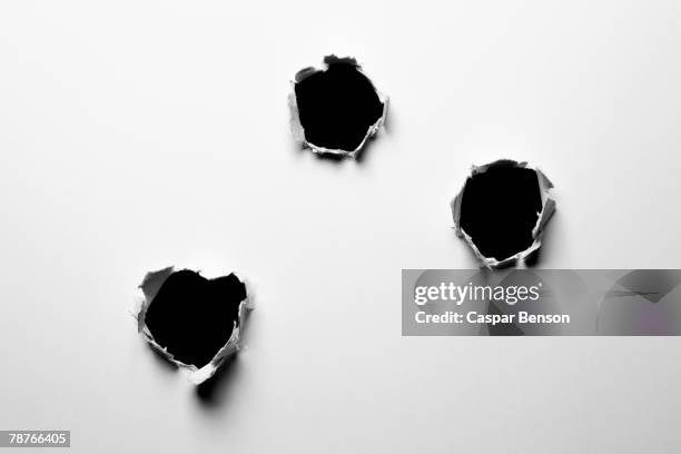 holes in a wall - tiro imagens e fotografias de stock