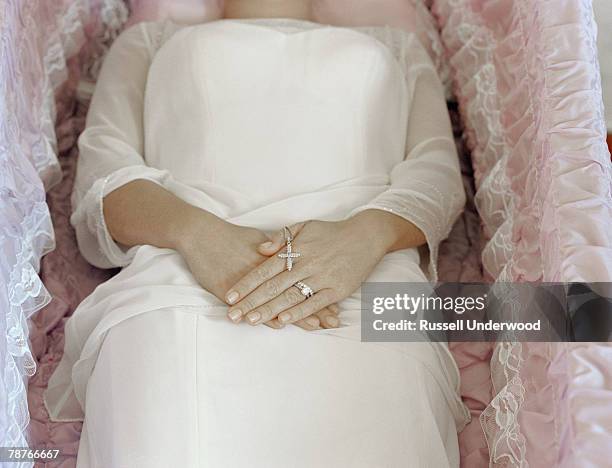 a woman lying in a coffin - coffin stock pictures, royalty-free photos & images