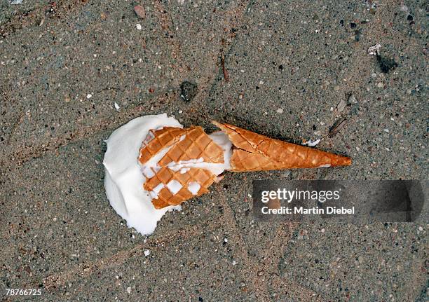 an ice cream dropped on the pavement - bad luck foto e immagini stock