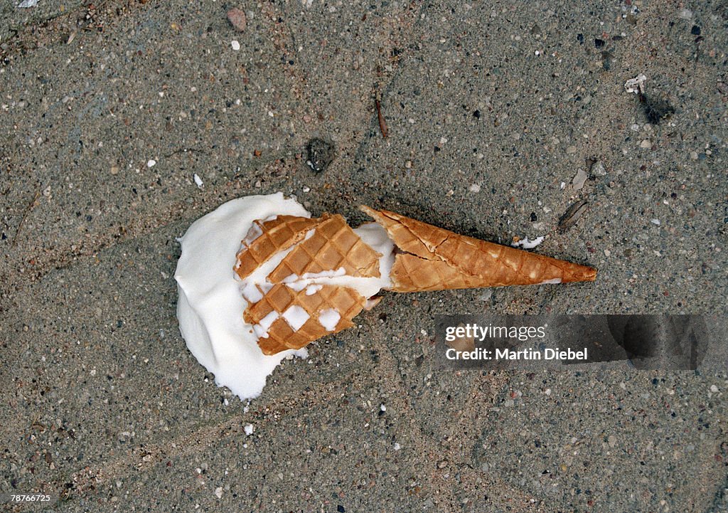 An ice cream dropped on the pavement