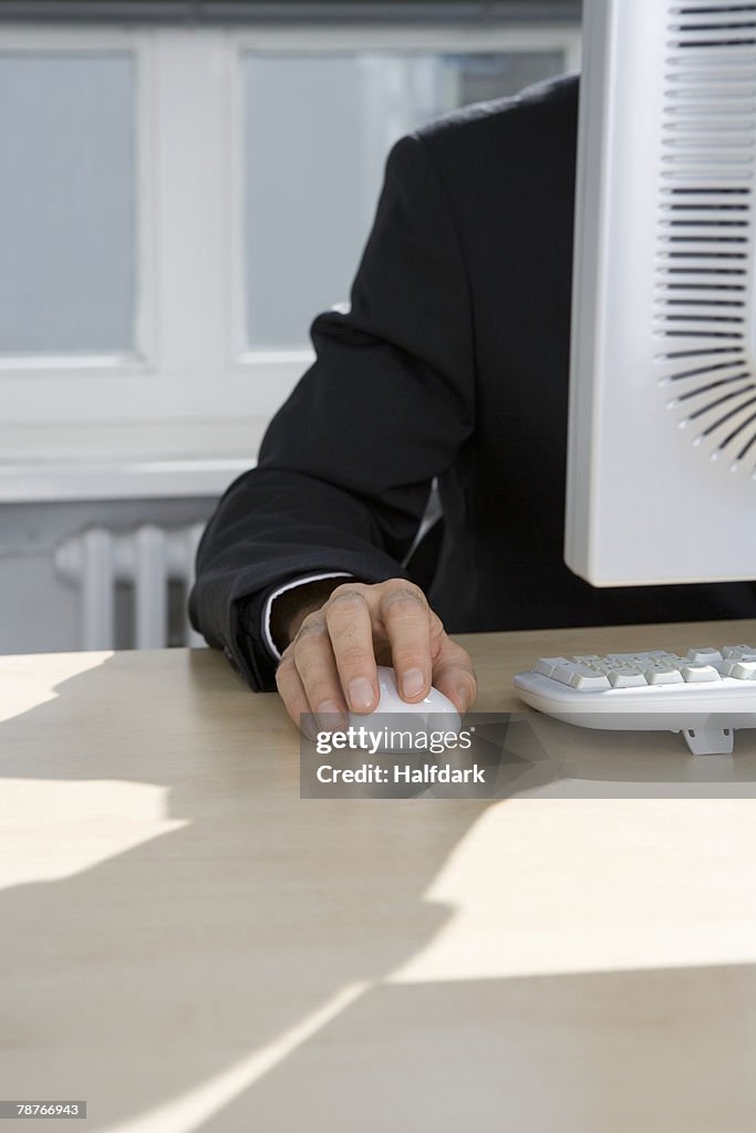 A man working behind a computer