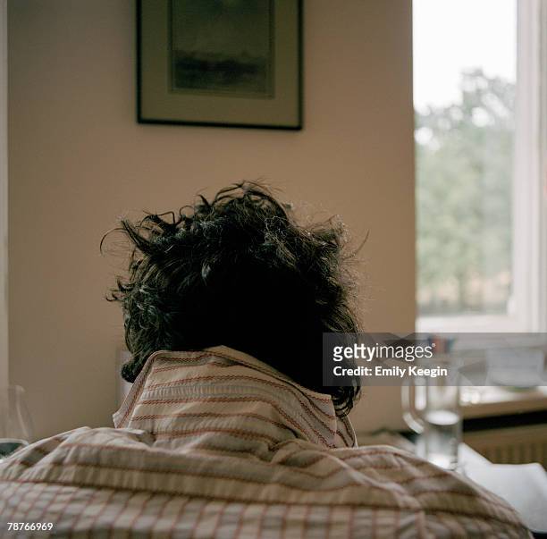 the back of a man's head - tousled hair man stock pictures, royalty-free photos & images