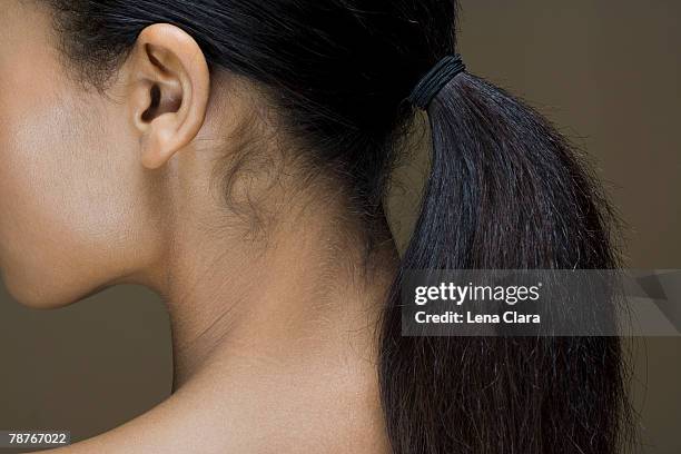 rear view of a woman's ponytail - black woman hair back stock pictures, royalty-free photos & images