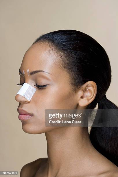 portrait of a woman with her nose bandaged - covering nose stock pictures, royalty-free photos & images