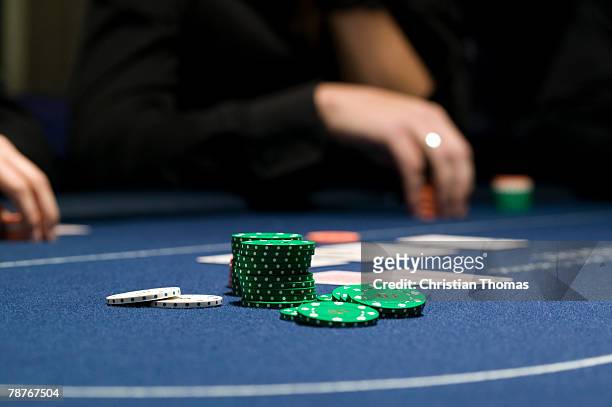 a stack of chips on casino table - texas hold 'em stock-fotos und bilder