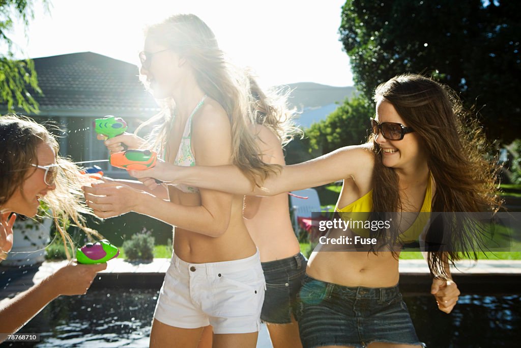 Teenage Girls with Squirt Guns