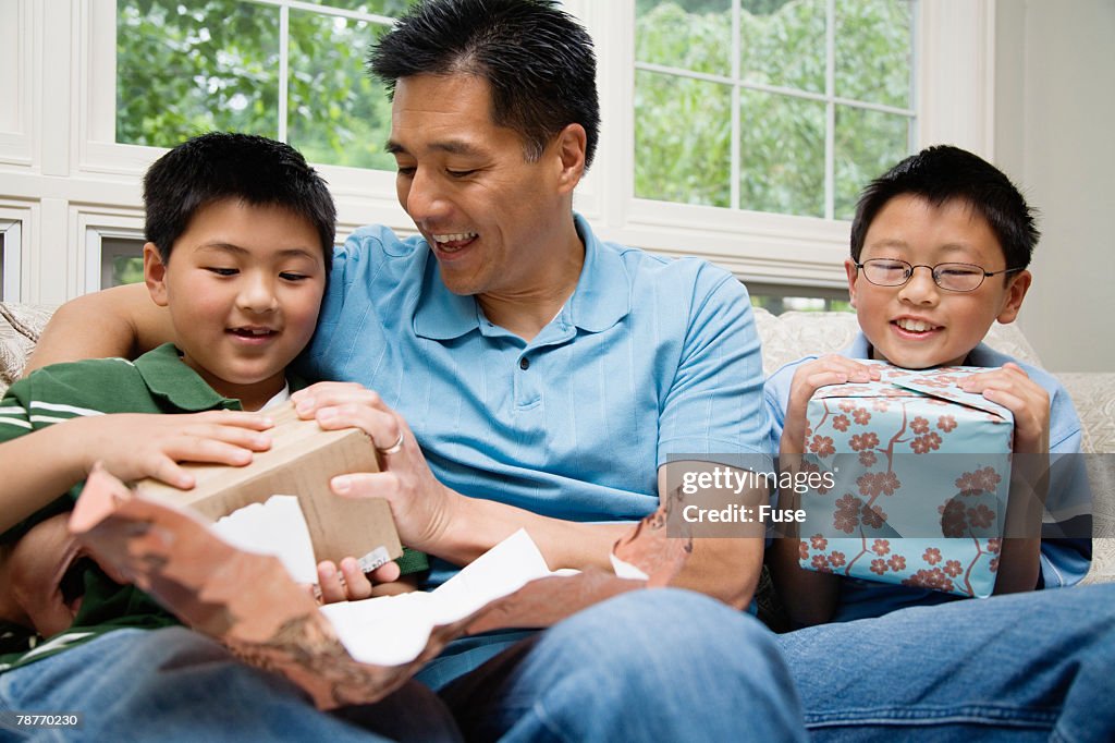 Father with Two Boys Celebrating Birthday