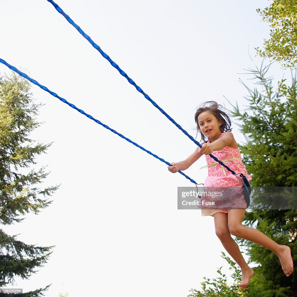 Girl Playing on Swing