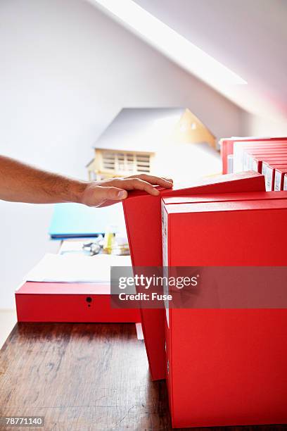 man organizing files - fille pull laine stock pictures, royalty-free photos & images