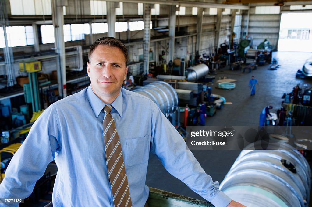 Businessman in Factory