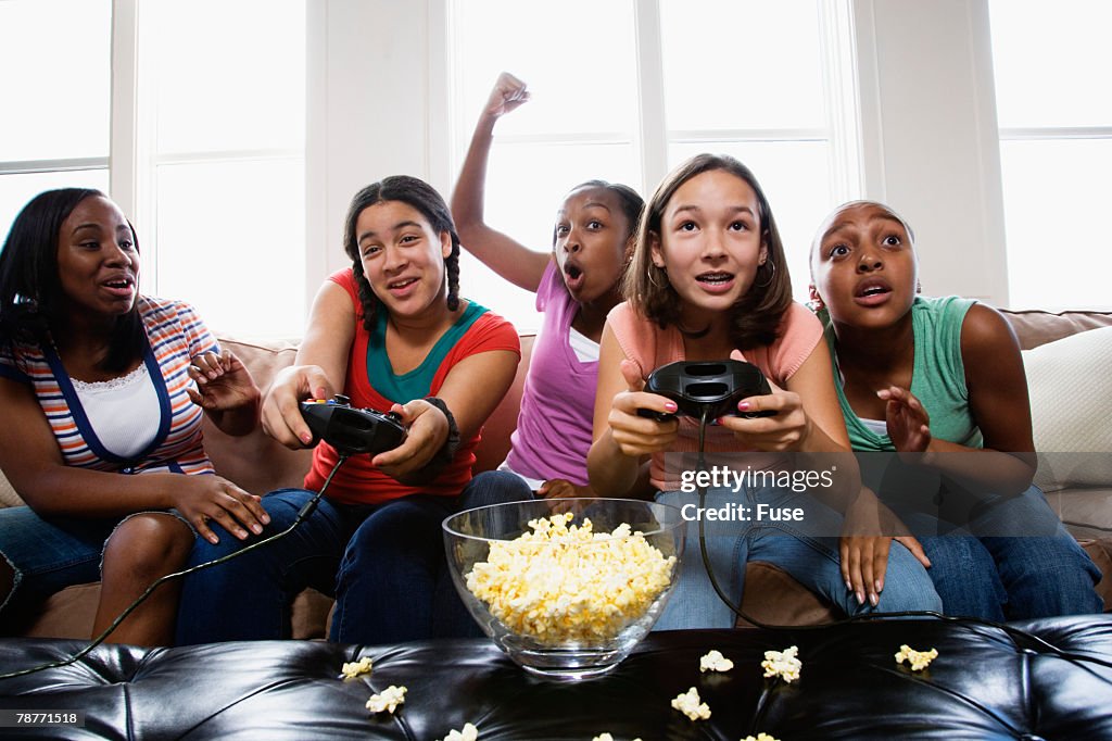 Teenage Girls Playing Video Game