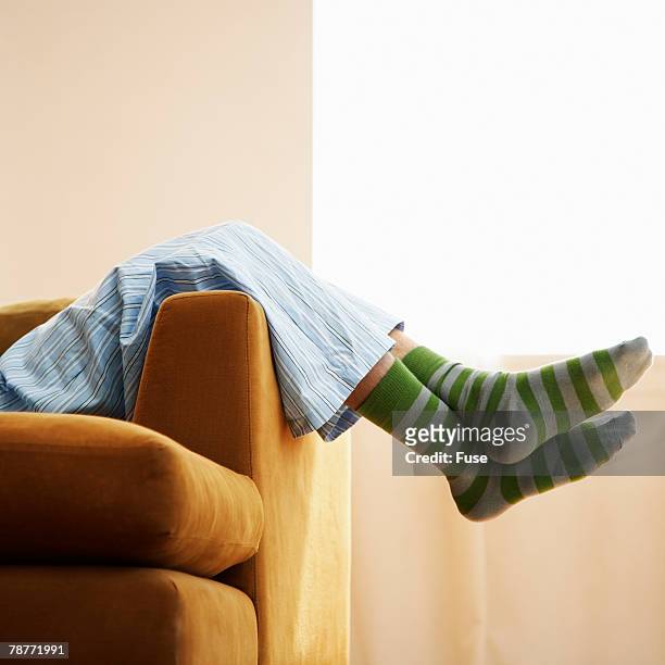resting on the couch - feet on table bildbanksfoton och bilder