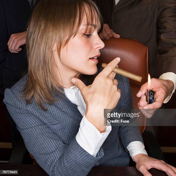 businesswoman with cigar - premium lighter stock pictures, royalty-free photos & images