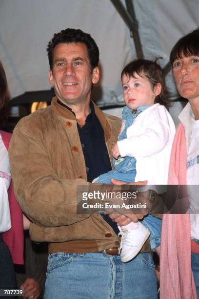 Paul Michael Glaser holds daughter Zoe at the Kids For Kids AIDS Benefit April 25, 1999 in New York City. The event organized by Elizabeth Glaser...