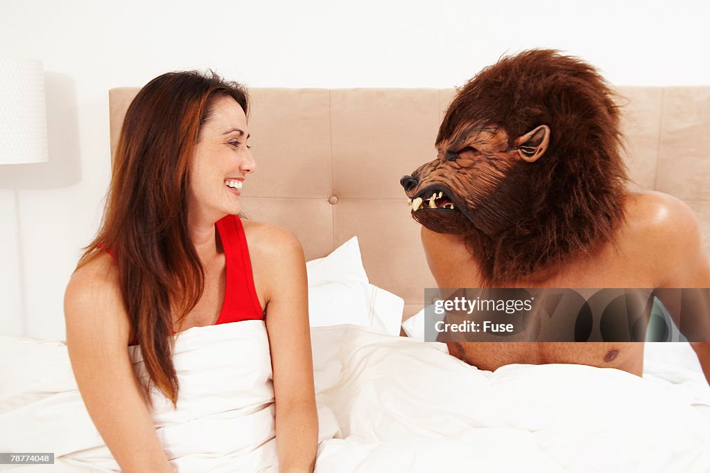 Man Wearing Werewolf Mask to Bed