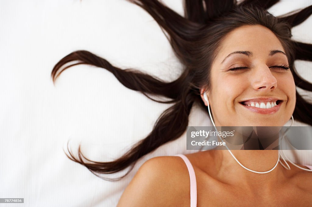 Woman Listening to Earphones