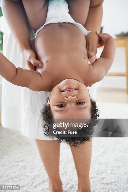 mother playing with baby - upside down stock pictures, royalty-free photos & images