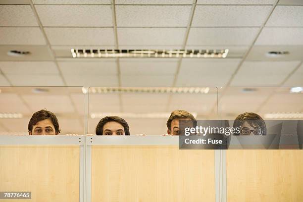 four office workers peering over partition - suspicion office stock pictures, royalty-free photos & images