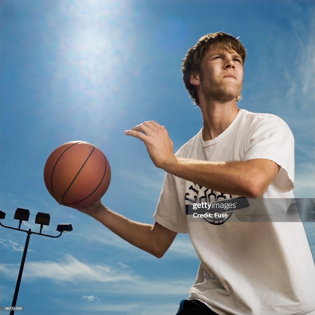 Basketball Player Holding Ball