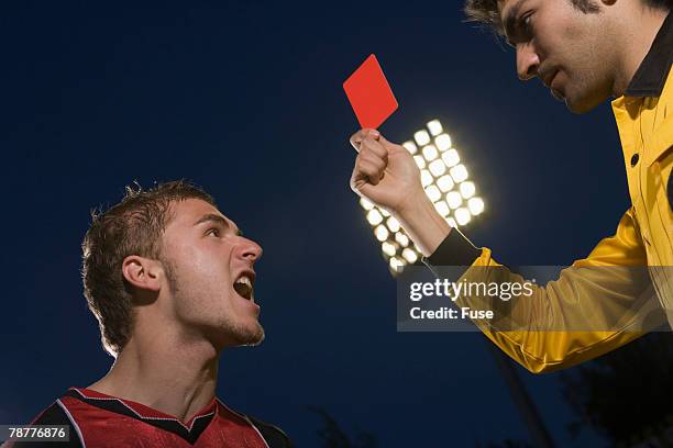 soccer referee giving red card - playing soccer profile stock pictures, royalty-free photos & images