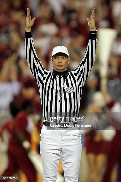 Field judge Bobby Aillet Jr. Signals touchdown during the game between the Oklahoma Sooners and the West Virginia Mountaineers at the Tostito's...