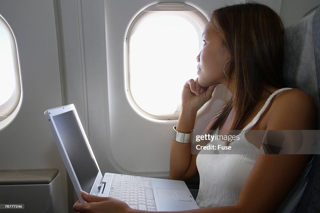 Traveling Woman on a Laptop