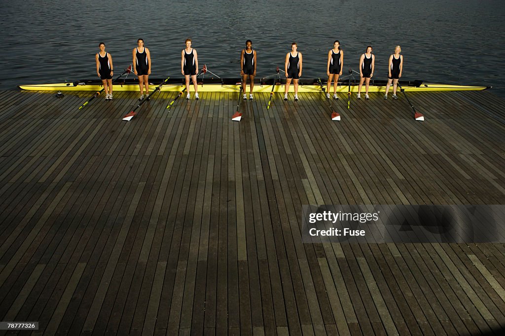 Crew Racing Shell Rowing Crew Standing By Racing Shell On Jetty High-Res Stock Photo ...