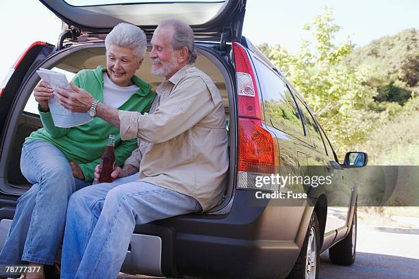 couple on a road trip - drinking soda in car stock pictures, royalty-free photos & images