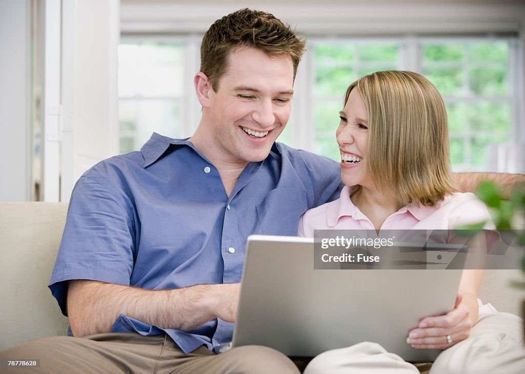 Couple Using Laptop