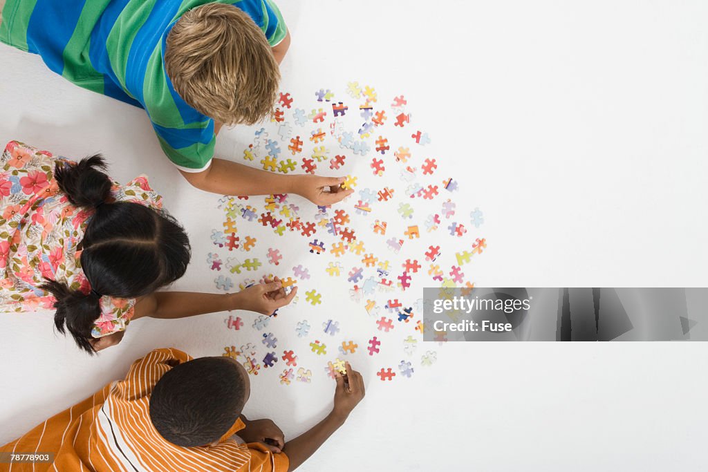 Children Working on Jigsaw Puzzle
