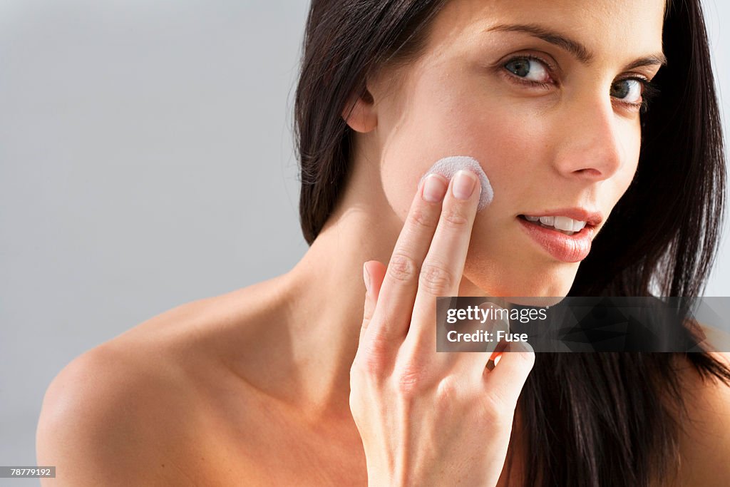 Woman Applying Facial Cream