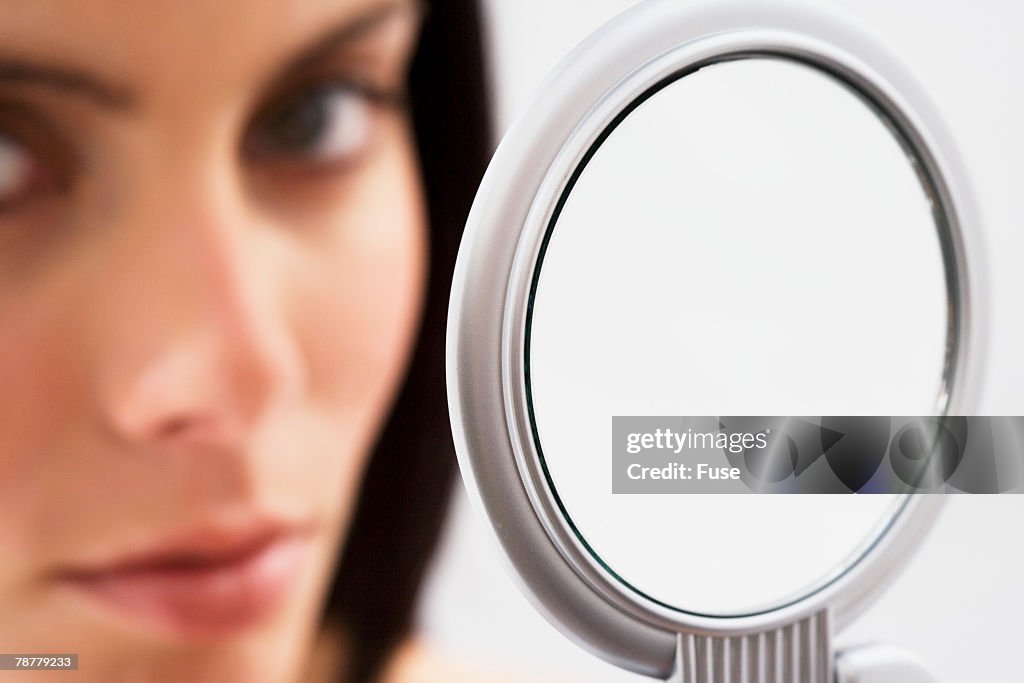 Woman Holding Hand Mirror