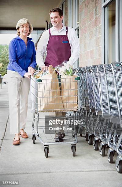 Crouthcing Employee In Store Grocery Store Employee Full Length Photos and Premium High Res Pictures ...