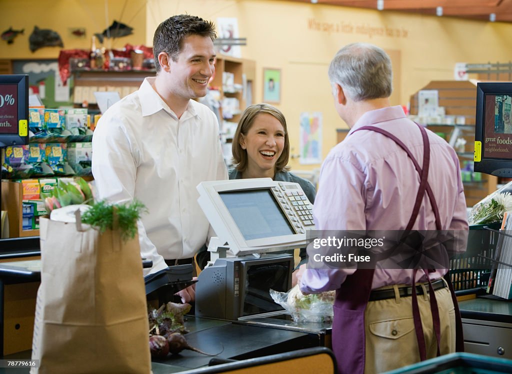 Cashier Ringing Up Supermarket Purchases