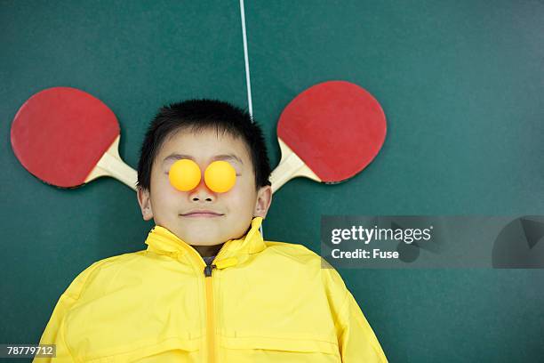 boy lying on ping pong table - funny ping pong stock-fotos und bilder