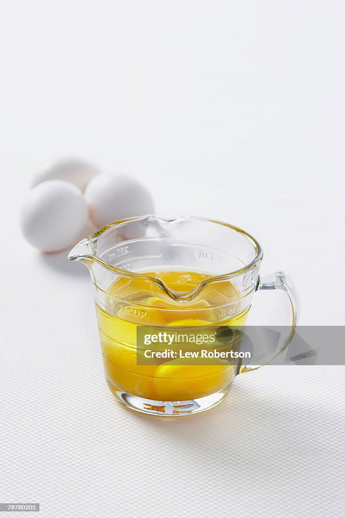 Fresh Eggs in a Measuring Cup