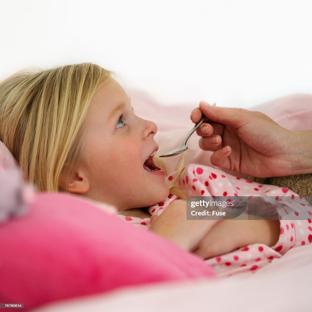 Girl Receiving Medicine