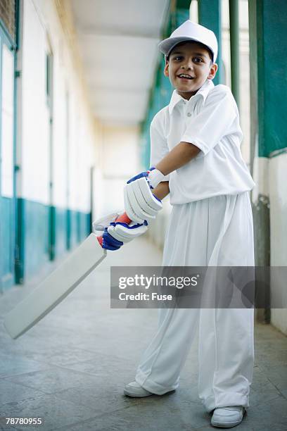 boy in cricket outfit - cricket player portrait stock pictures, royalty-free photos & images