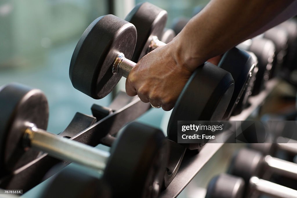 Man Lifting Dumbbells