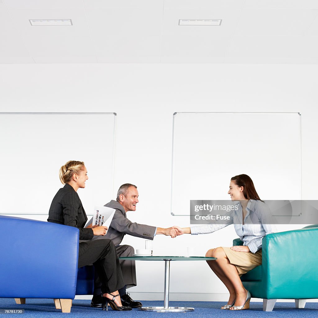 Businesspeople Greeting a Job Candidate