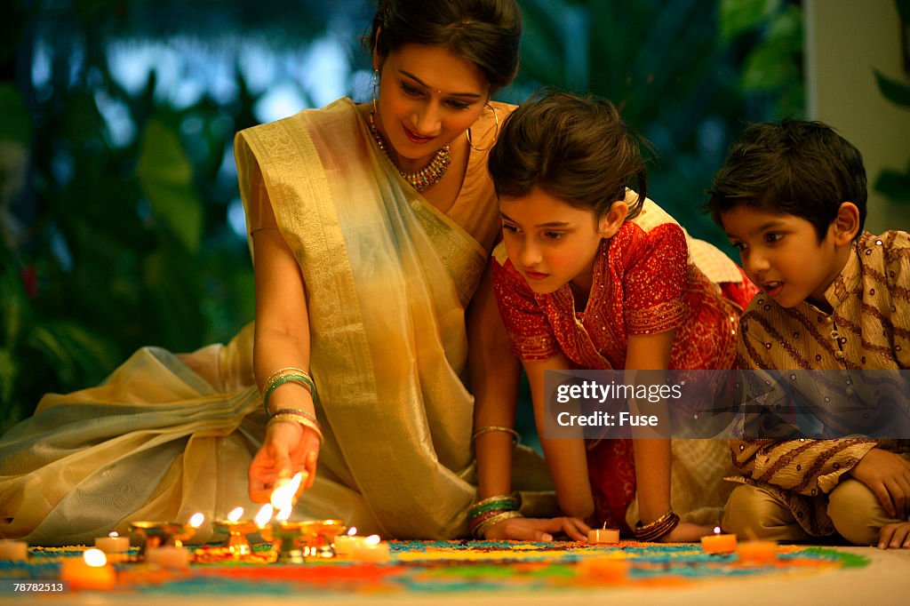 Family Looking at <Kolam>, or <Rangoli> Drawings