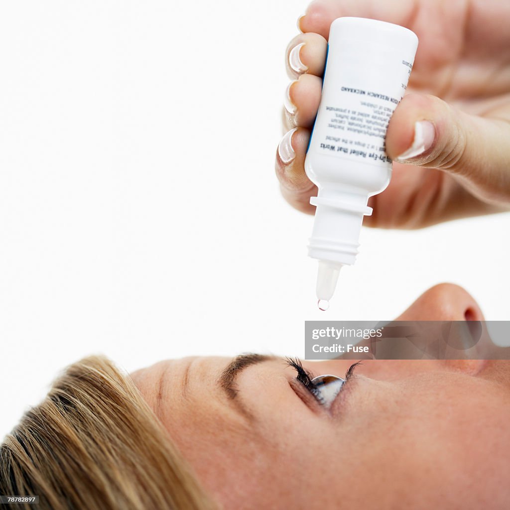 Woman Applying Eye Drops