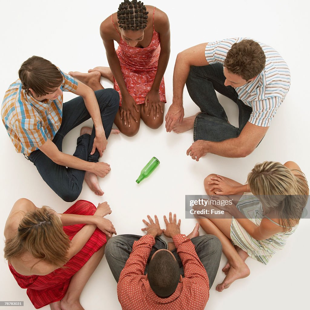 People Playing Spin the Bottle