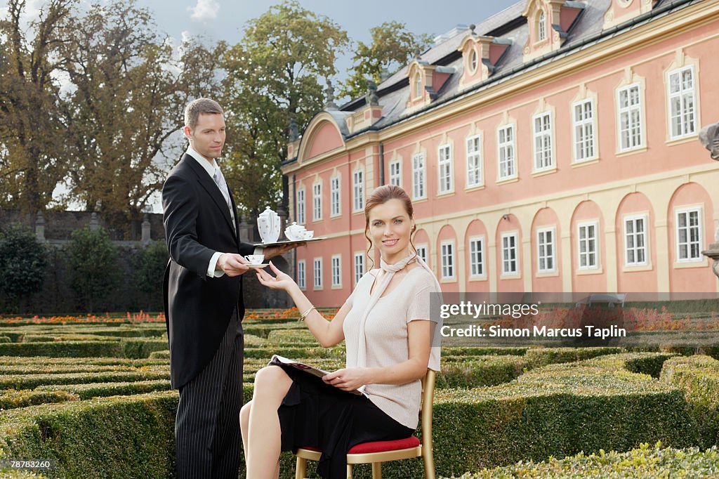 Butler Serving Tea to Lady at Manor House