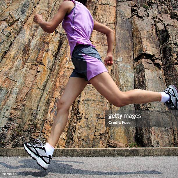 woman running - physical geography ストックフォトと画像