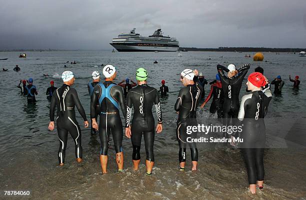 Swimmers enter the water for the start of the Port Of Tauranga Half Ironman Triathlon at Mount Maunganui on January 5, 2008 in Tauranga, New Zealand.