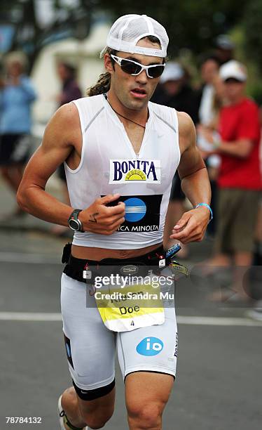 Kieran Doe of New Zealand competes in the run leg during the Port Of Tauranga Half Ironman Triathlon at Mount Maunganui on January 5, 2008 in...