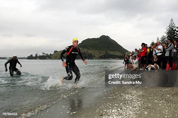 Cameron Brown of New Zealand exits the water in the swim leg during the Port Of Tauranga Half Ironman Triathlon at Mount Maunganui on January 5, 2008...