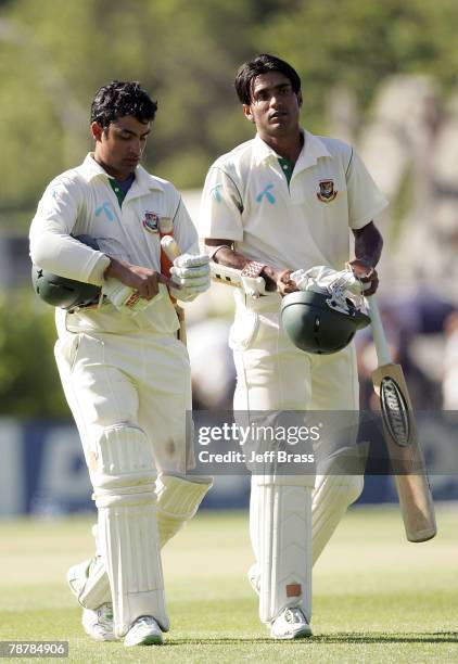 Tamim Iqbal and Zunaed Siddique of Bangladesh leave the field at the end of play on day two of the the First Test match between New Zealand and...