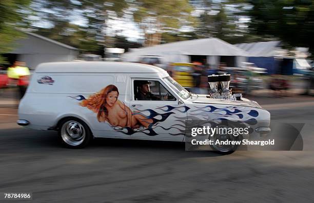 One of the many customised cars heads down a track during Street Machine Summernats 21 Car Festival at Epic Park on January 5, 2008 in Canberra,...